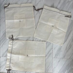 Set of Three Cream Dust Bags. New
